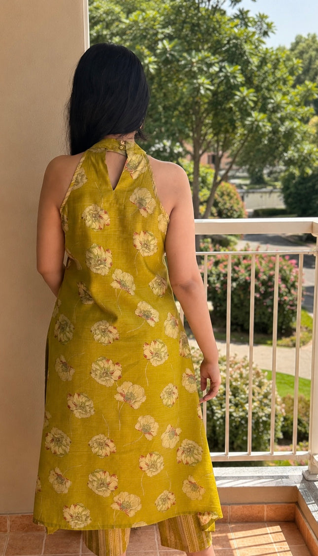 Elegant olive green floral printed kurta set for women with coordinated striped pants and comfortable summer styling.