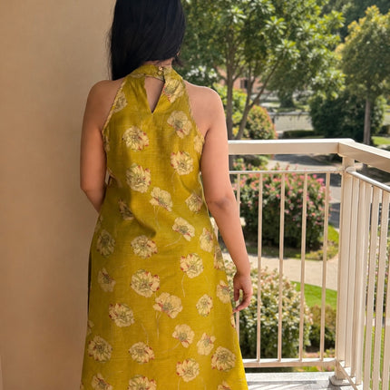 Elegant olive green floral printed kurta set for women with coordinated striped pants and comfortable summer styling.