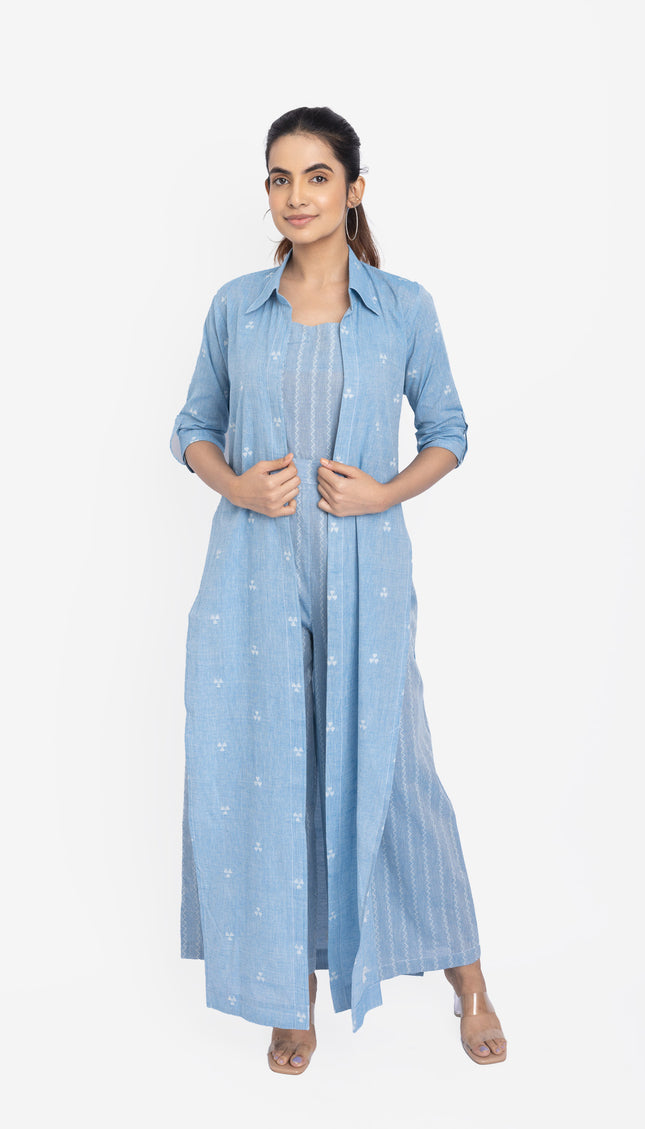 Woman wearing a light blue outfit with a matching shirt and pants