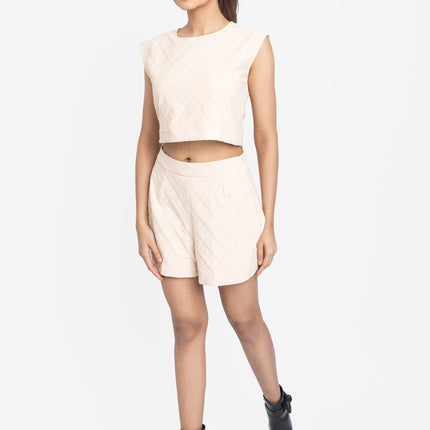 Woman wearing a sleeveless top and shorts set