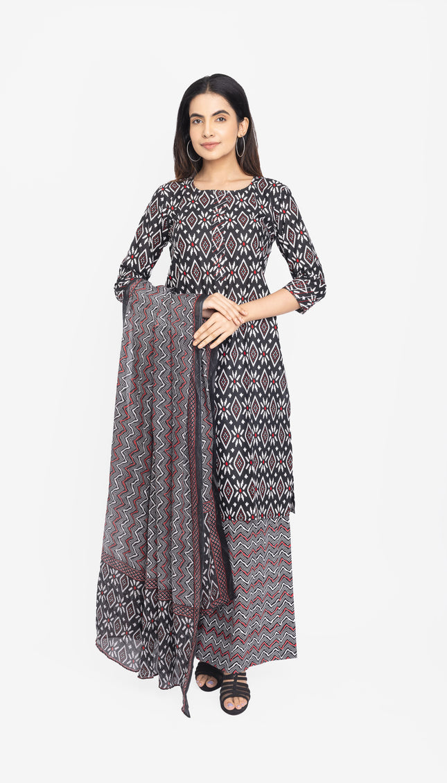 Woman wearing a patterned dress with a matching dupatta