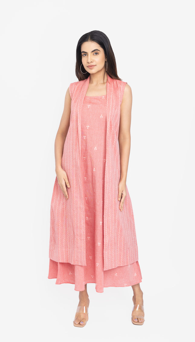 Woman wearing a pink dress with a matching shrug