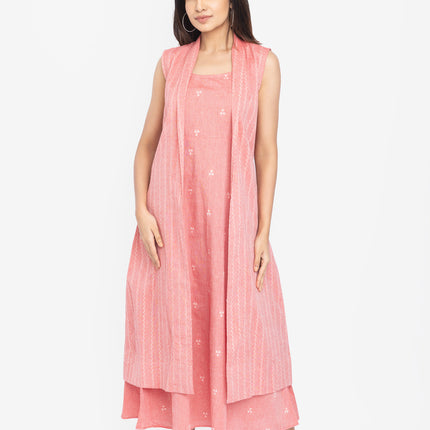 Woman wearing a pink dress with a matching shrug