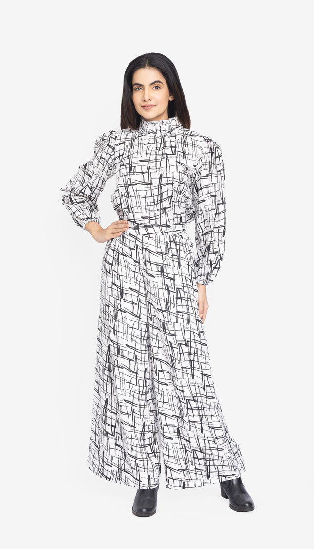Woman wearing a black and white patterned dress