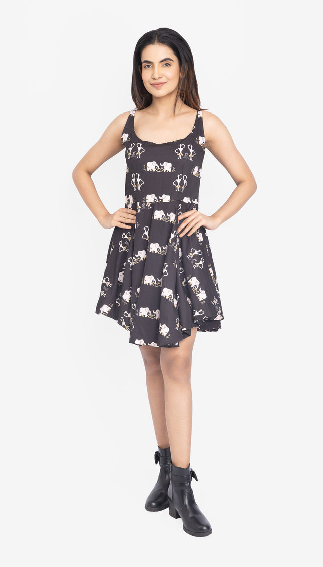 Woman wearing a black dress with white patterns