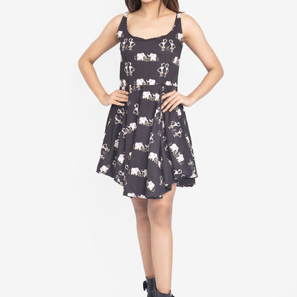 Woman wearing a black dress with white patterns