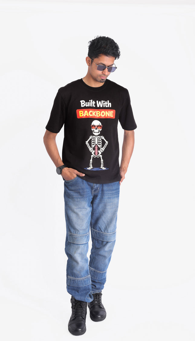 Person wearing a black t-shirt with a skeleton graphic and text