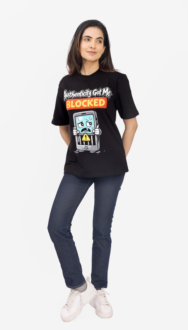 Person wearing a black t-shirt with a graphic design and text 