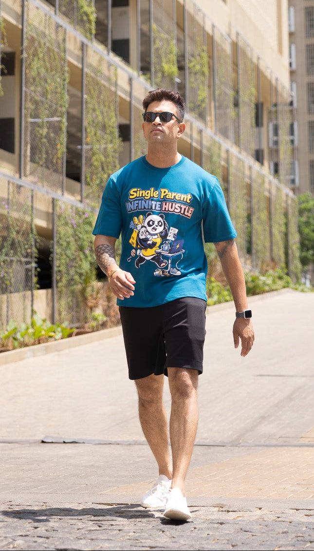 Man walking on a sidewalk with buildings in the background