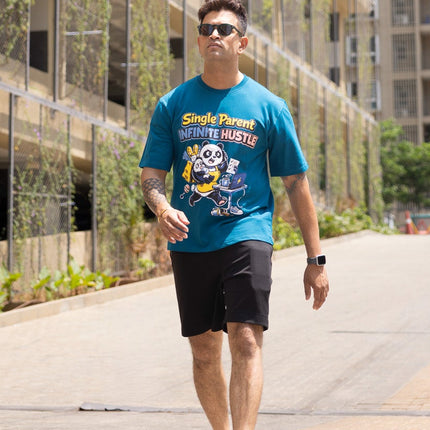 Man walking on a sidewalk with buildings in the background